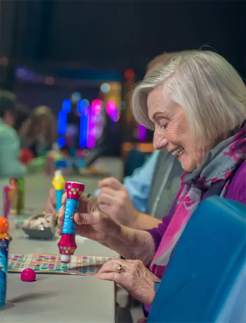 Woman daubing a Bingo card